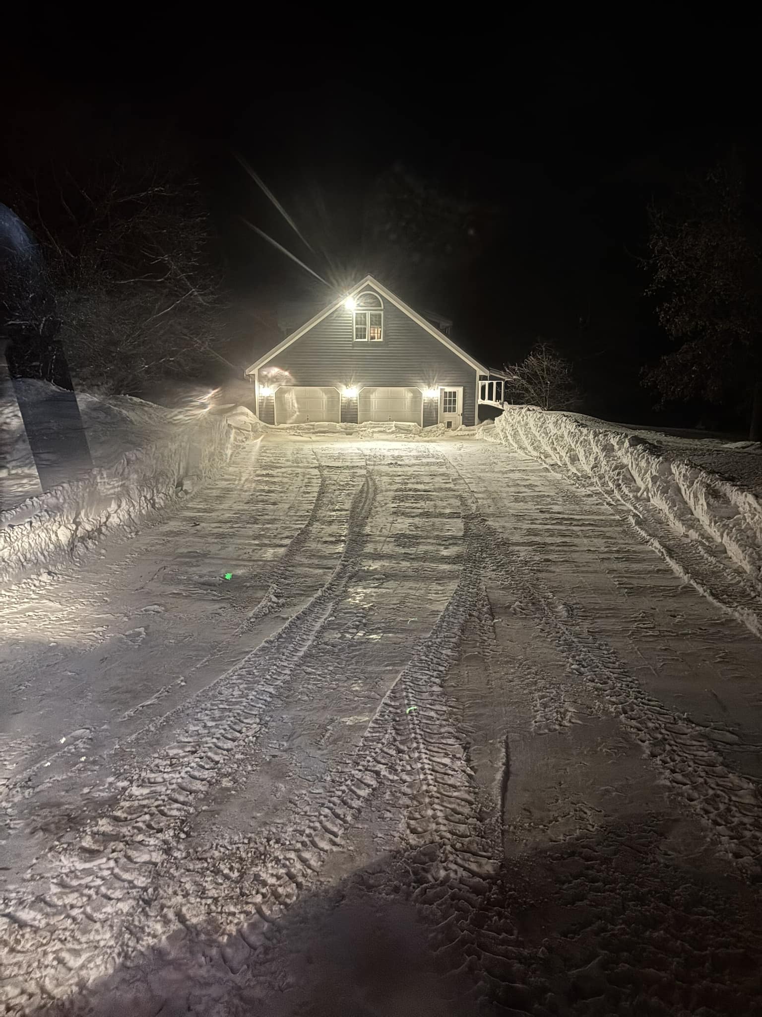 Snowblowing near garage entry after blizzard